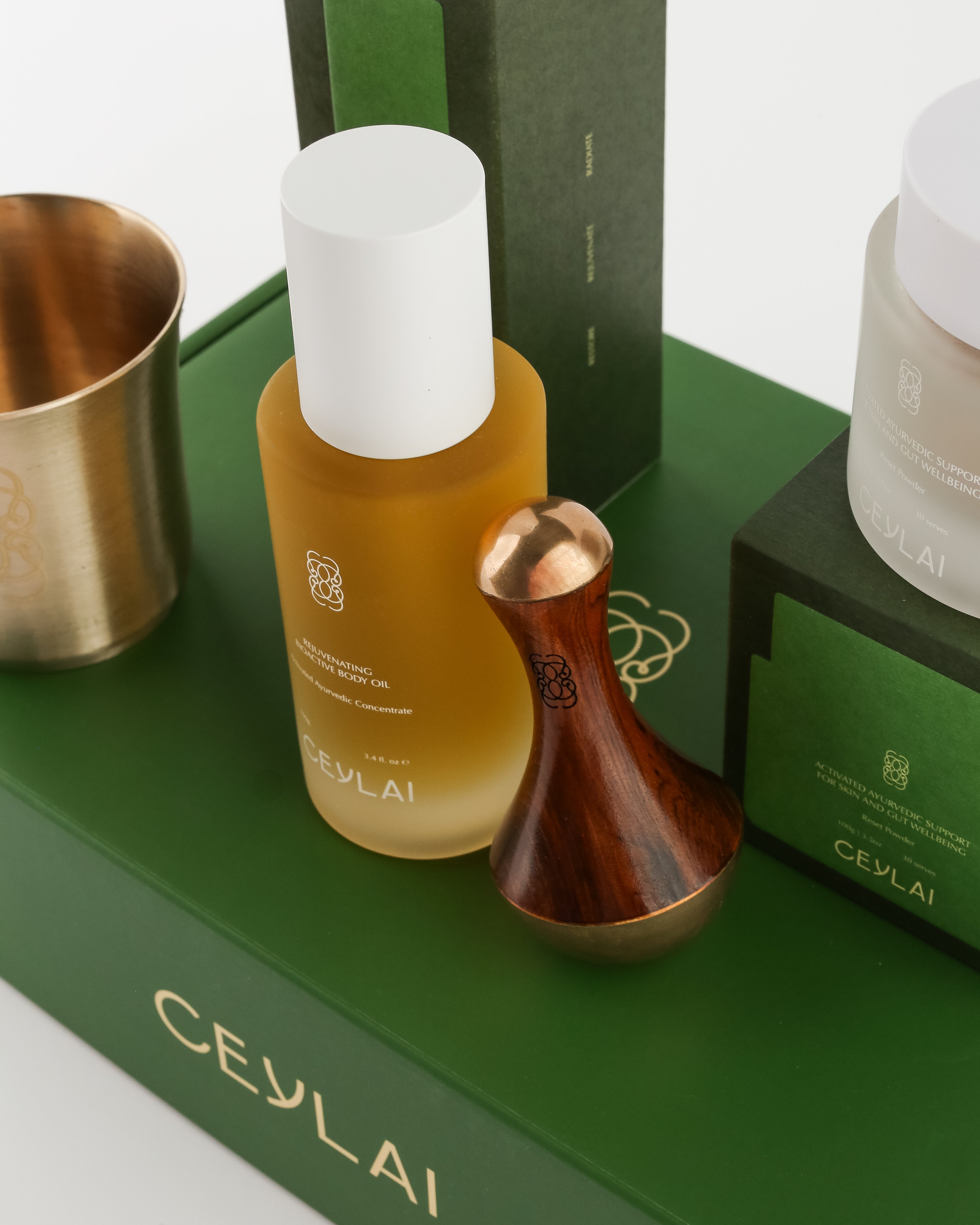 Ceylai Body Oil and Kansa Wand on green Ceylai packaging