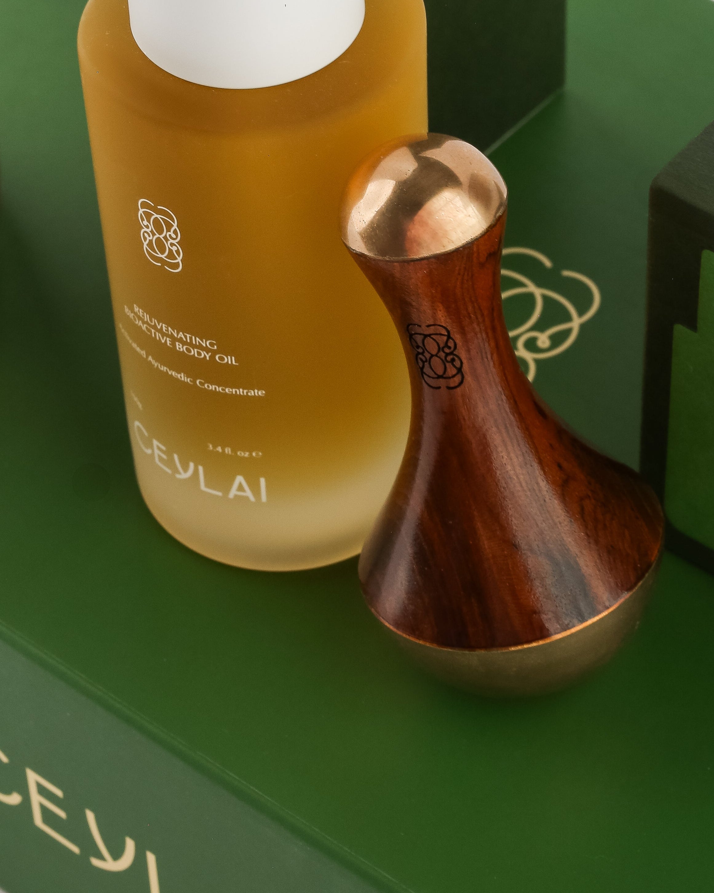 Ceylai skincare products on a green surface with a white background